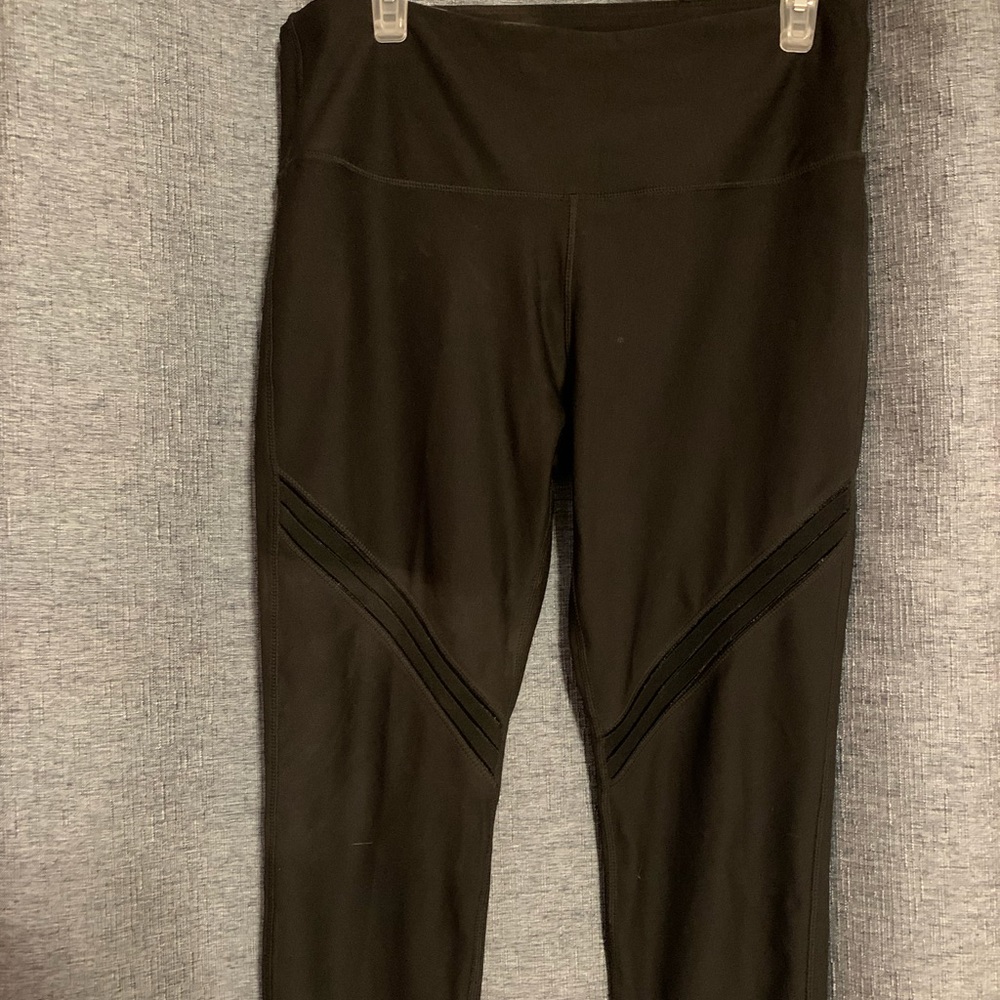 NWOT Avia black Leggings. Cute mesh detail on each leg.